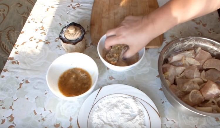 After the eggs, roll the fish in breadcrumbs.