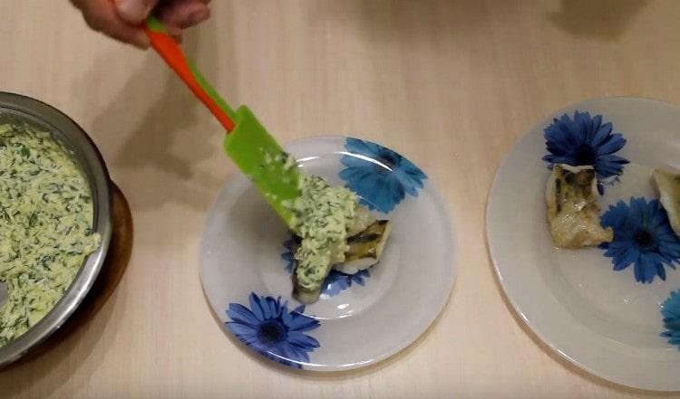 We serve pike perch in Polish. pouring fish in creamy egg sauce.