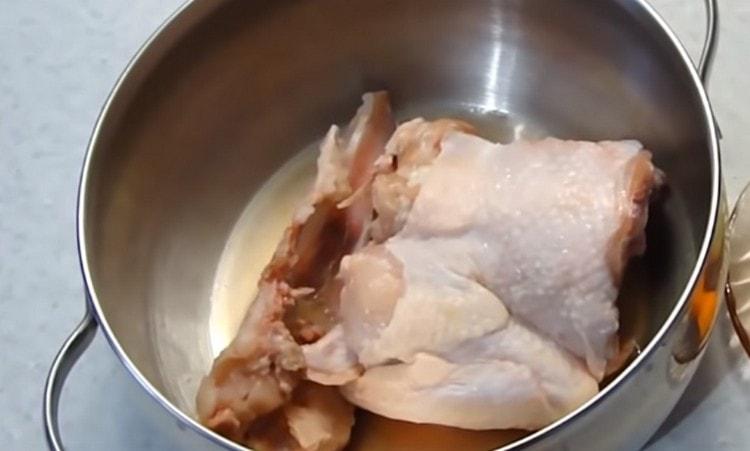 We wash the chicken parts.