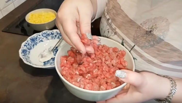 To prepare the filling, cut the meat into a small cube.