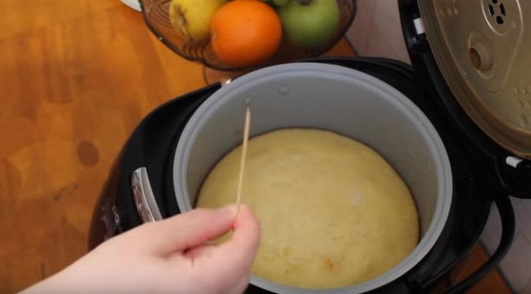 Check the cupcake for readiness with a toothpick.