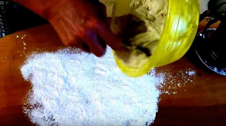 The dough is still a little liquid, so put it on a floured work surface and knead.