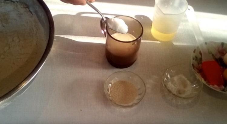 Add sugar to warm milk and mix.