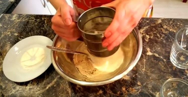 Add yeast, sugar and a little flour.