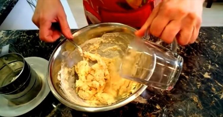 Add warm water to the dough.