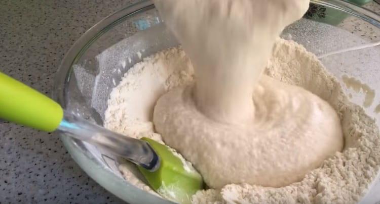 Add the dough to the flour.