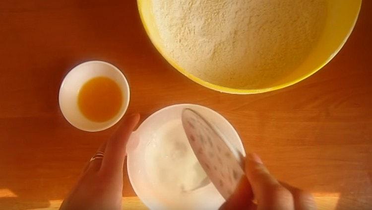 Pour salt and sugar into warm water.