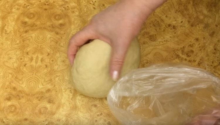Such a dough for pasties on water needs to be wrapped in a plastic wrap or bag and placed in the refrigerator for an hour.