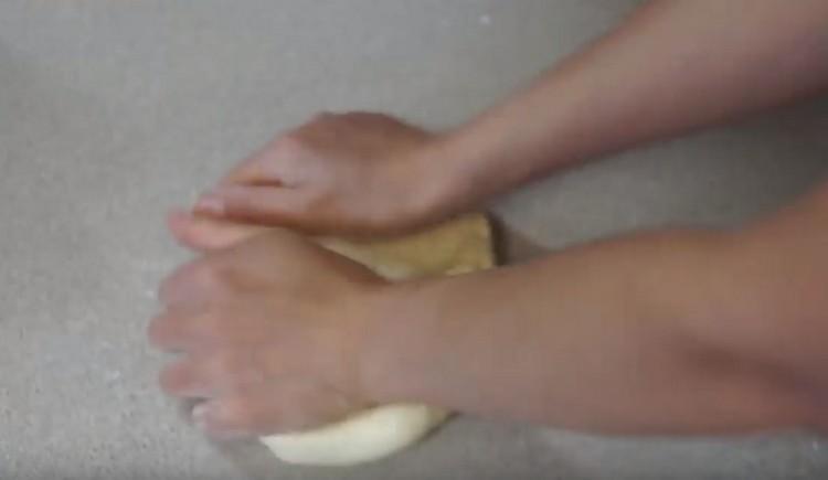 When the dough thickens, knead it well with your hands.