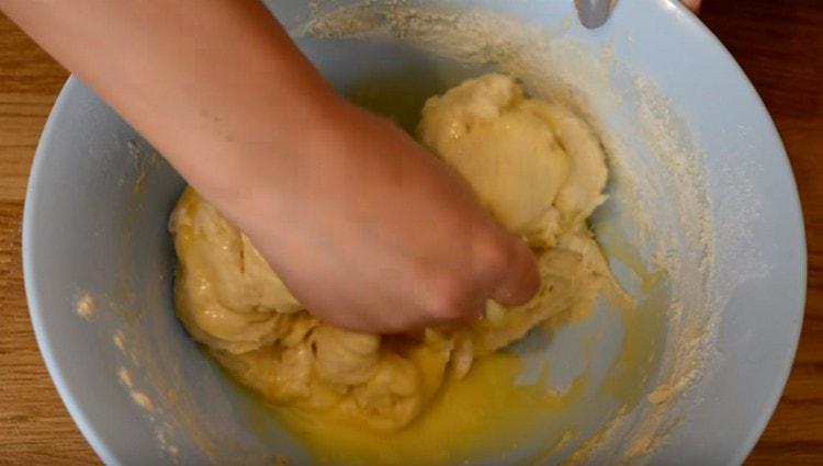 Stir the butter into the dough, add more flour.