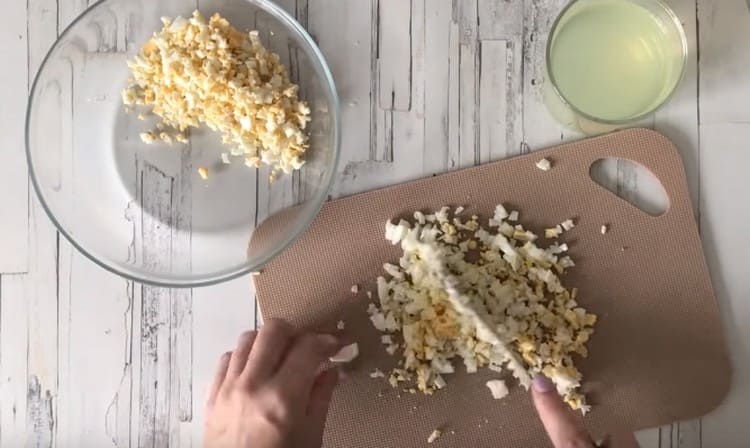 Finely chop two hard-boiled eggs.