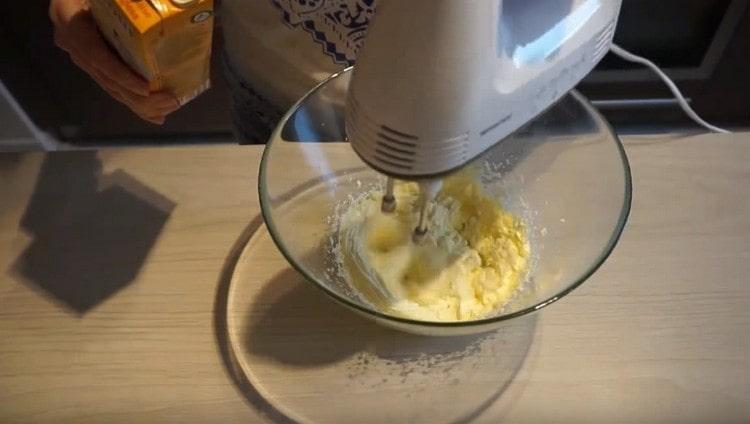 Whipping the butter, add Angles cream to it or a simple custard base for the cream.