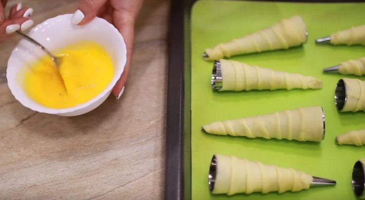 Beat the egg yolk by adding a little milk.