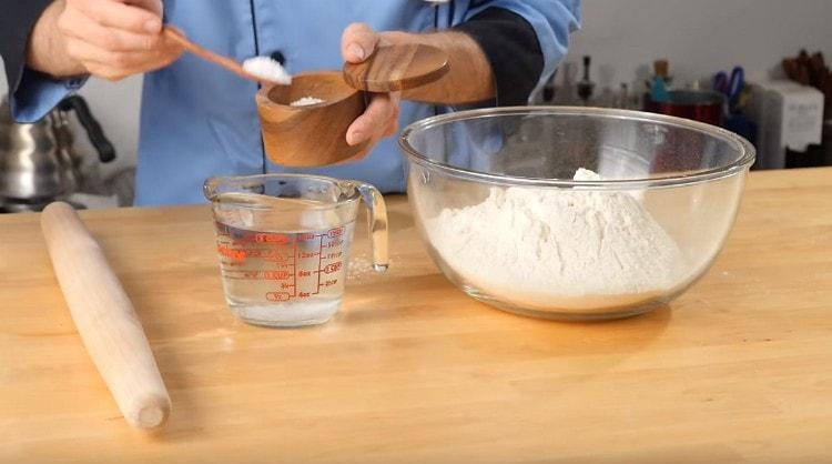 Dissolve salt in water.