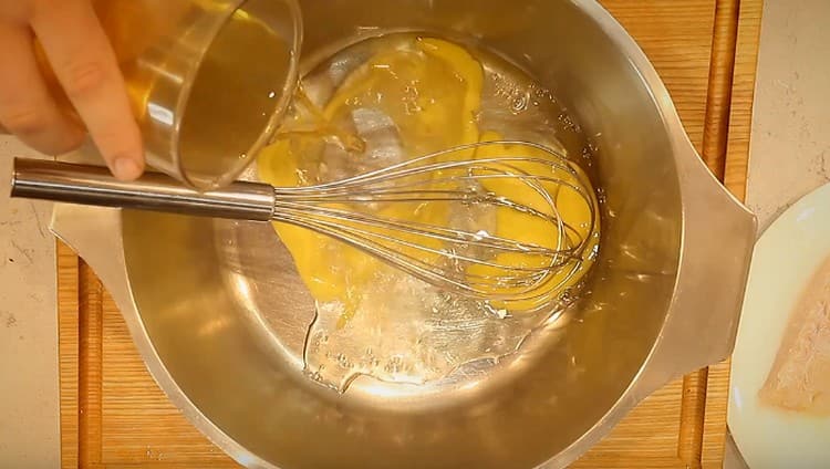 For batter we take eggs, add white wine to them.