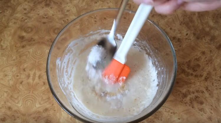 Add mineral water, salt, sugar to the dough and mix.