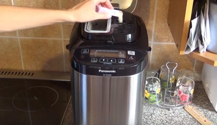 Pour dry yeast into a special compartment.