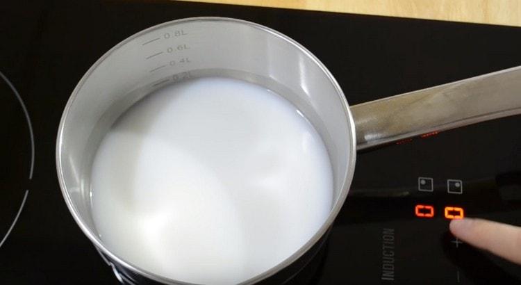 Having mixed water with milk, we heat this mixture a little.