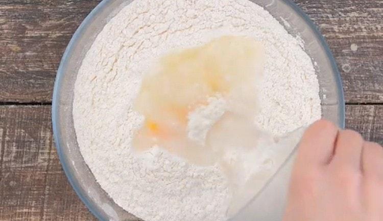 Add melted butter and boiling water to the flour.