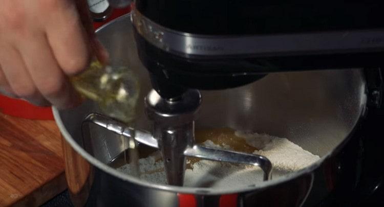 Add the vegetable oil to the flour.