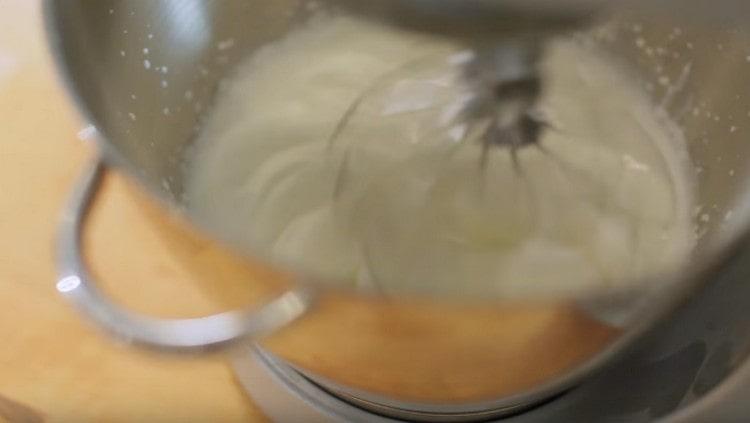 Whip the cream with a mixer.