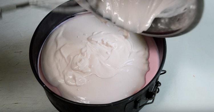 Pour the lightest layer of souffle into the mold.