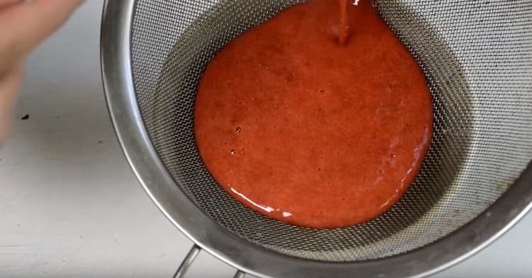 Pass the strawberry puree through a sieve.