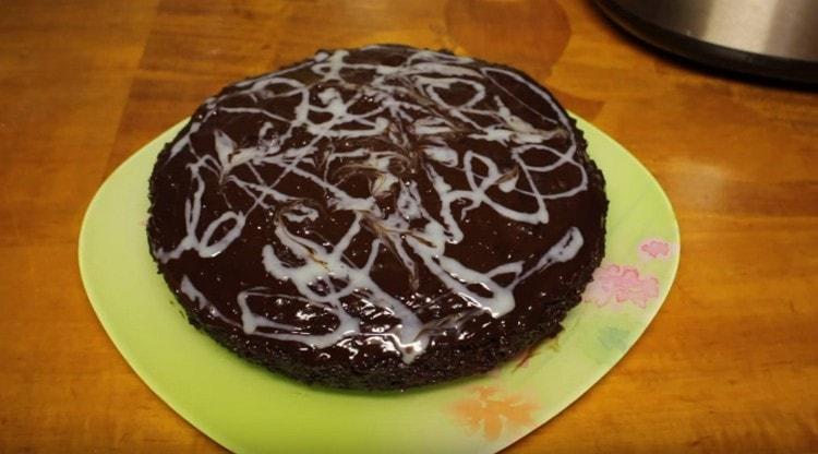 Such a chocolate muffin, cooked in a slow cooker, can be additionally decorated with condensed milk, berries, nuts.