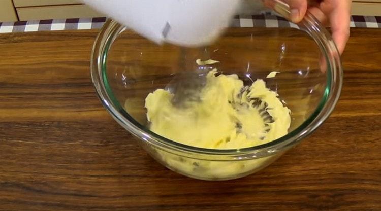 Beat softened butter.