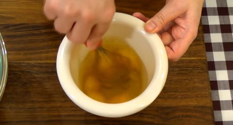 Separately, beat eggs with a whisk.
