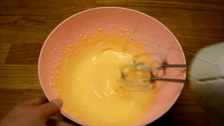 Mix the ingredients to make an orange muffin