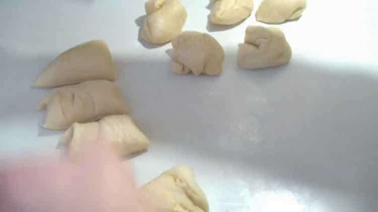 To make hot dog buns, divide the dough