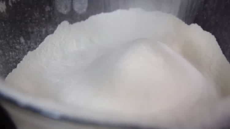 Sift flour to make buns with poppy seeds