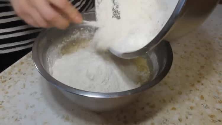 Sift flour to make jam muffins