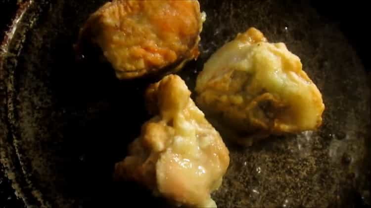 To cook pink salmon in batter in a pan, heat the pan