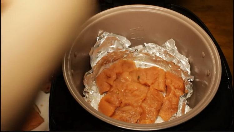 To cook pink salmon in a slow cooker, put the fish in a bowl