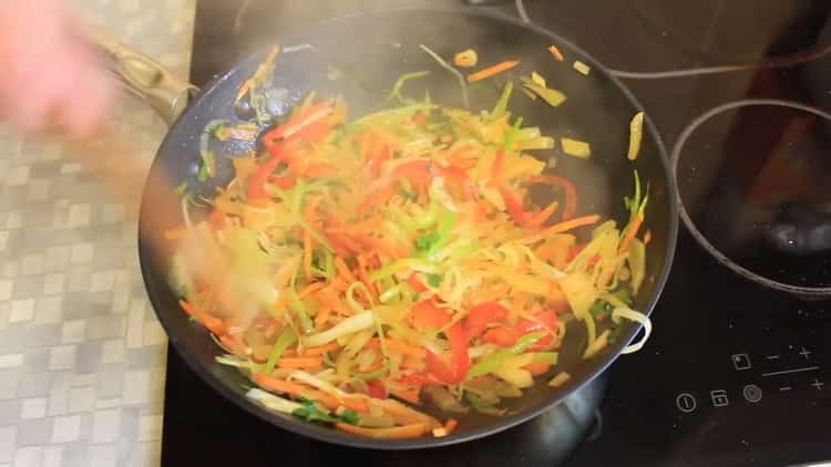 To cook pink salmon with vegetables in the oven, fry vegetables