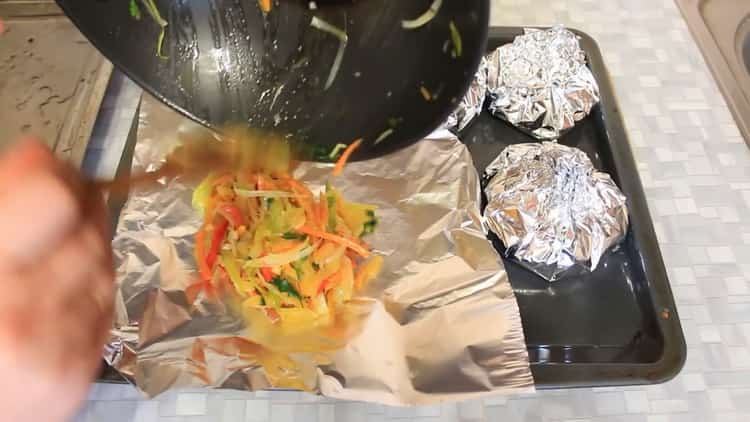 To prepare pink salmon with vegetables in the oven, place the ingredients on a foil