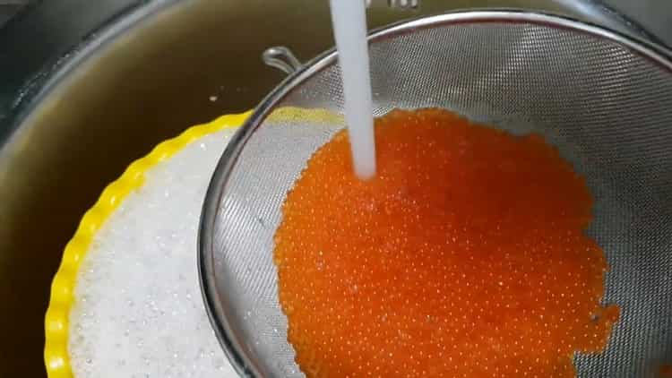 Before salting trout caviar, flush caviar