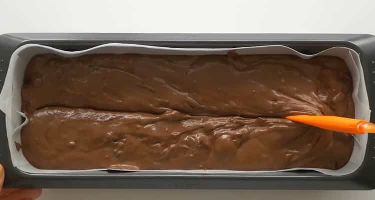 To make a cupcake with a cherry, put the dough in a mold