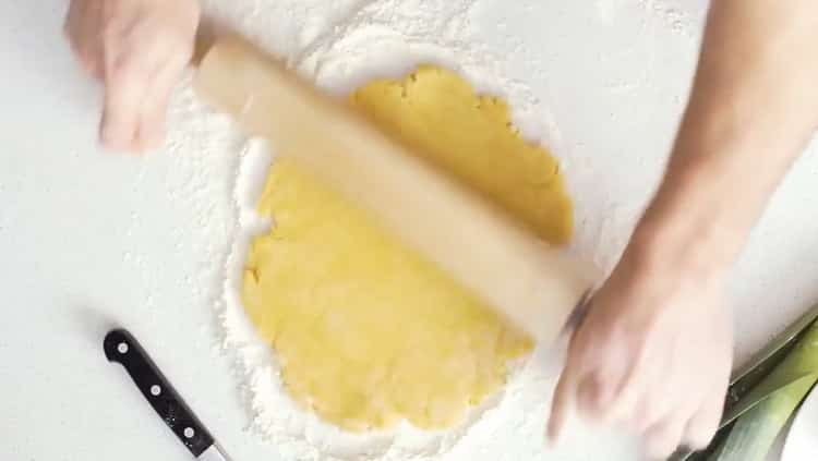 To make quiche with fish, roll out the dough