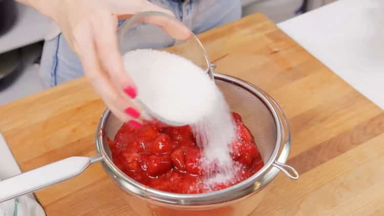 To make strawberry cheesecake, mix the berries with sugar.