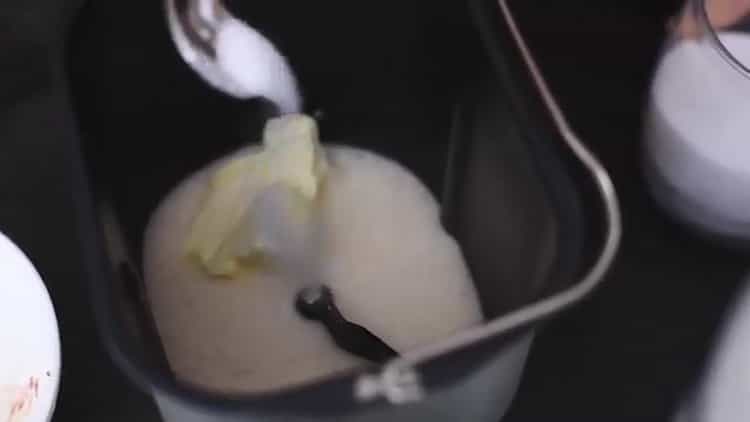 To prepare a cake in a bread machine, put the ingredients in a bowl