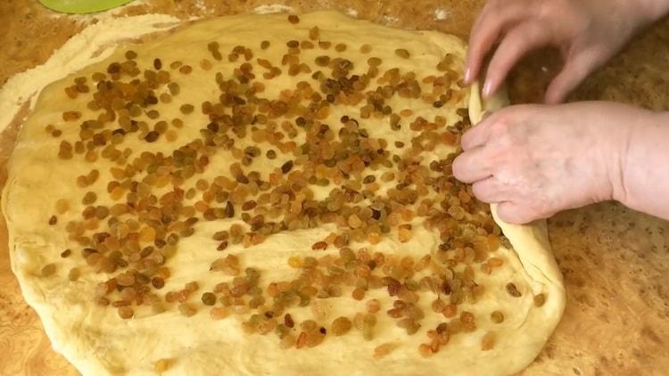 For raisin cakes, put raisins on the dough