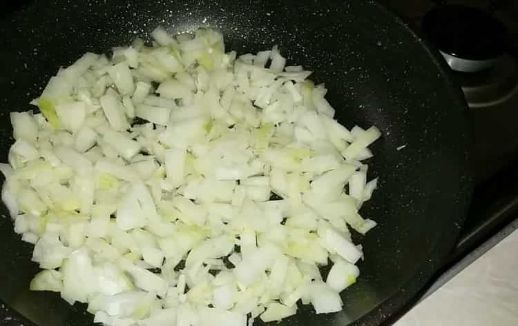 To make flat cakes in the oven, chop the onion