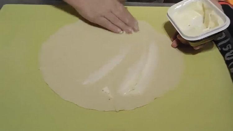 To make flat cakes on water, grease the dough with butter