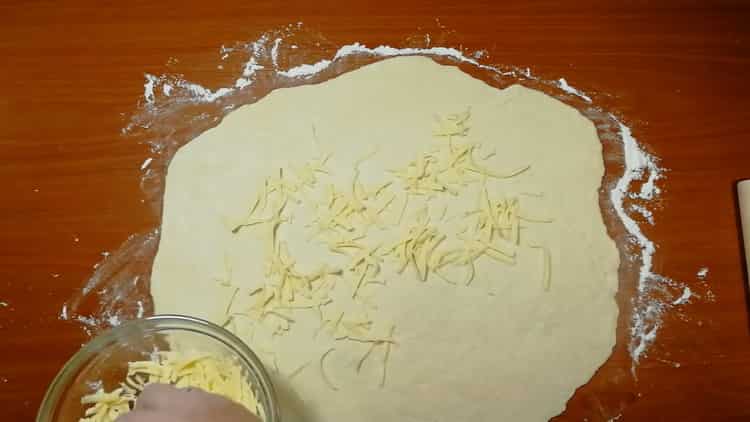 To make cheese cakes, put cheese on the dough