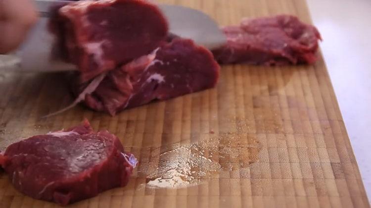 Cooking pasta with minced meat in a pan