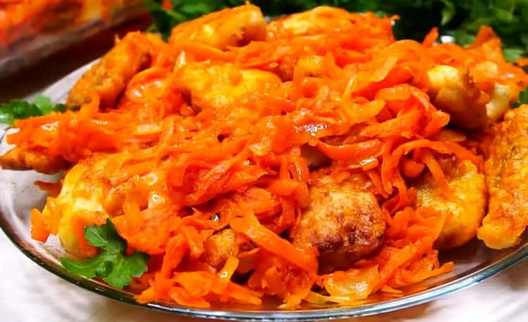 Pollock with marinated carrots and onions
