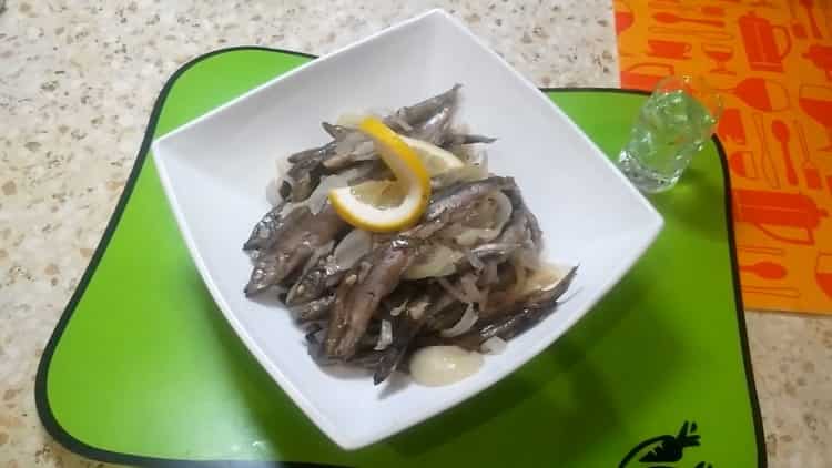 Capelin stewed with onions in a pan - quick and tasty
